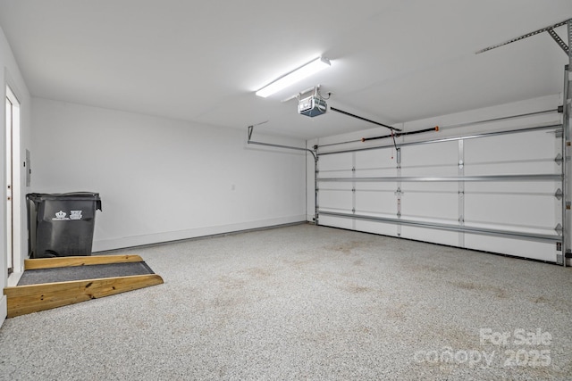 7502 Hurstbourne Green Dr, Charlotte, NC 28277 - garage featuring a garage door opener and baseboards