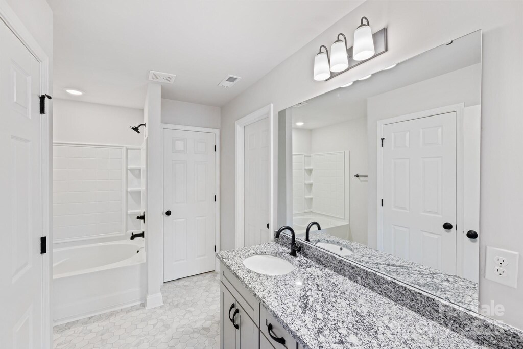 4175 River Run Cir, Hickory, NC 28602 - bathroom with tile patterned flooring, vanity, visible vents, and baseboards