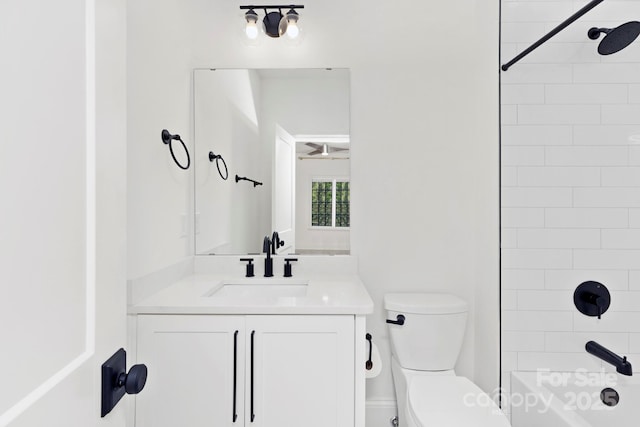 full bath featuring vanity, bathtub / shower combination, and toilet