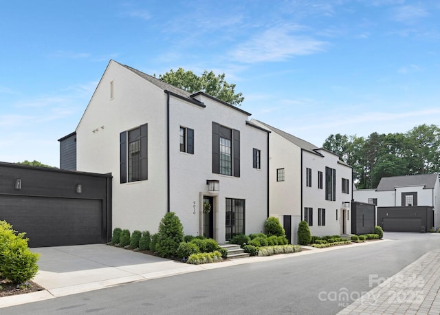 view of front of home featuring concrete driveway