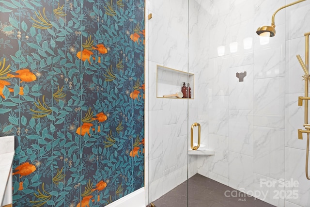 bathroom with tiled shower