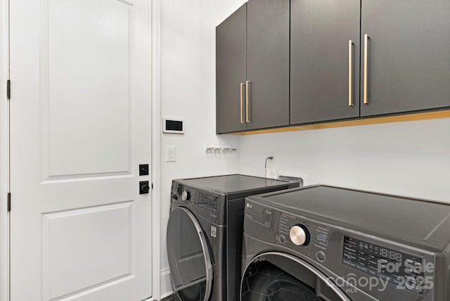 laundry room featuring cabinet space and independent washer and dryer