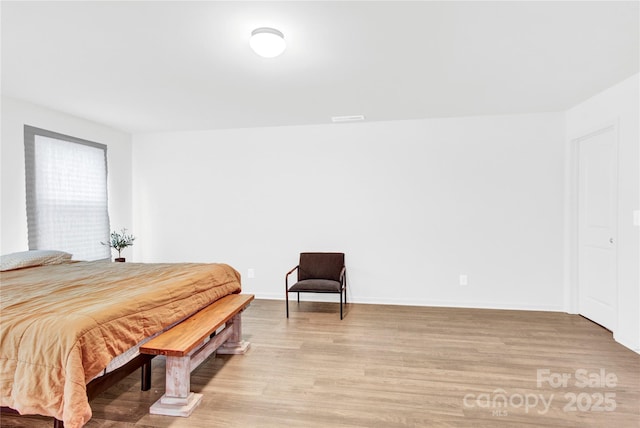 3153 Pinehills Way, Mount Holly, NC 28120 - bedroom with baseboards, visible vents, and light wood-style floors