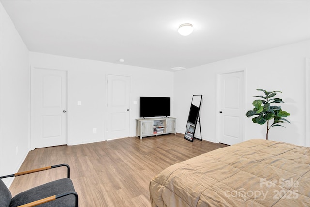 3153 Pinehills Way, Mount Holly, NC 28120 - bedroom with baseboards and wood finished floors