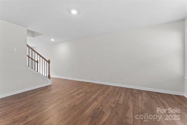interior space featuring baseboards, recessed lighting, dark wood-type flooring, and stairway