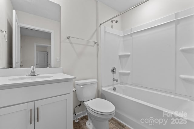 bathroom with shower / bathtub combination, vanity, and toilet
