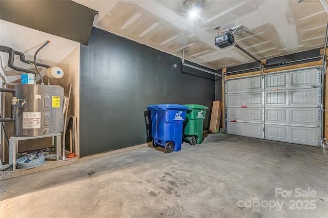 garage with a garage door opener and electric water heater