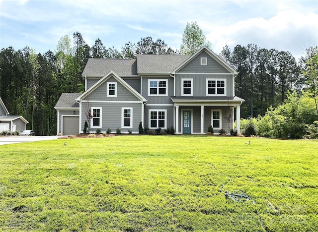 117 Blackbeard Ln, Mooresville, NC 28117 - craftsman-style house with an attached garage, concrete driveway, a front lawn, and covered porch