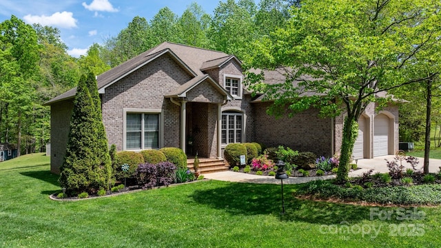 view of front facade featuring brick siding, a front lawn, driveway, and a garage