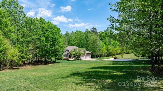 view of yard featuring a garage