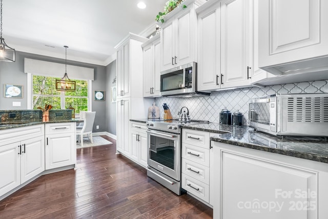 kitchen featuring white cabinetry, tasteful backsplash, and stainless steel appliances