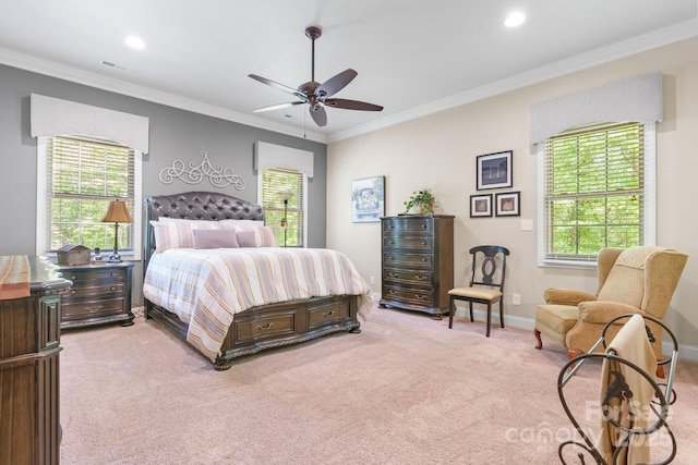 bedroom featuring visible vents, light colored carpet, and multiple windows