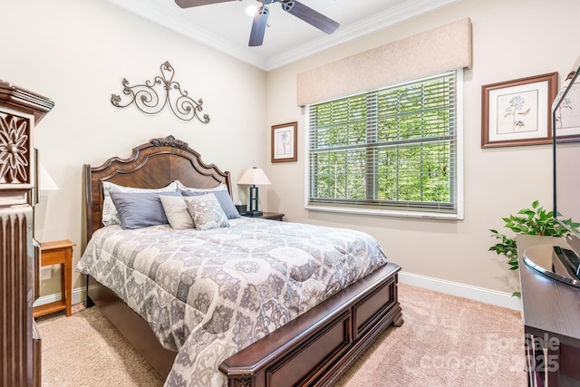 bedroom featuring ceiling fan, baseboards, light colored carpet, and crown molding