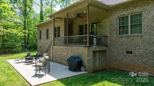 view of patio with a ceiling fan and a grill