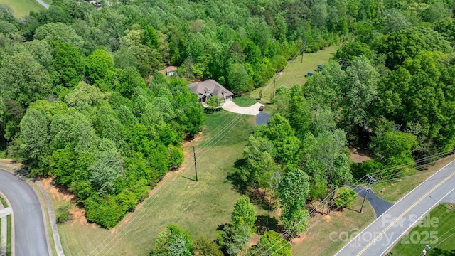 bird's eye view featuring a view of trees