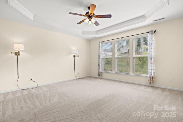 20135 Dovekie Ln, Fort Mill, SC 29707 - carpeted spare room with ceiling fan, baseboards, visible vents, crown molding, and a tray ceiling