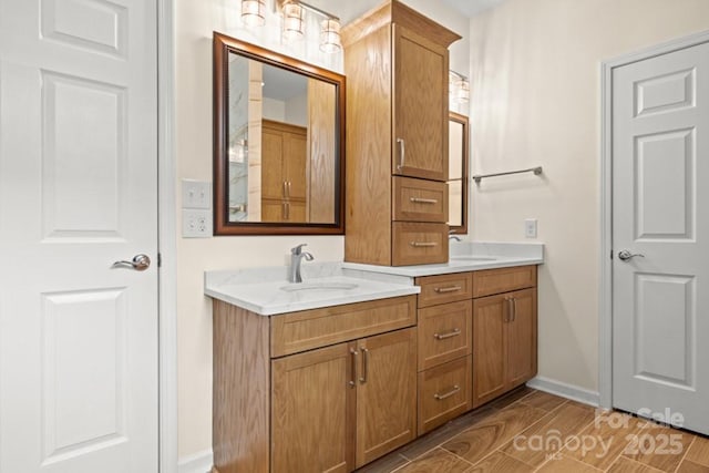 20135 Dovekie Ln, Fort Mill, SC 29707 - full bathroom with baseboards, wood tiled floor, double vanity, and a sink