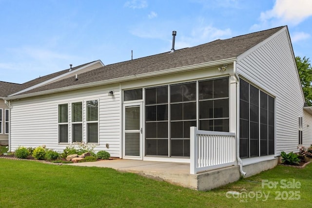 20135 Dovekie Ln, Fort Mill, SC 29707 - back of property with roof with shingles, a sunroom, and a lawn