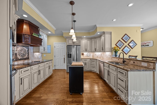 kitchen with custom exhaust hood, a sink, a peninsula, crown molding, and stainless steel appliances