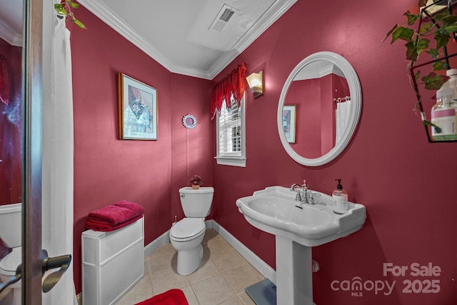 bathroom with ornamental molding, visible vents, tile patterned flooring, toilet, and baseboards