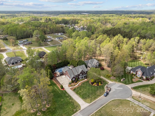 aerial view featuring a forest view