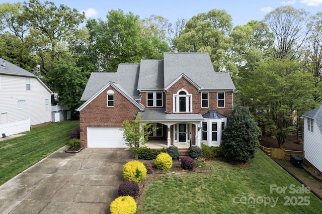 9009 Tayside Ct, Huntersville, NC 28078 - traditional home with a porch, brick siding, a front lawn, driveway, and roof with shingles