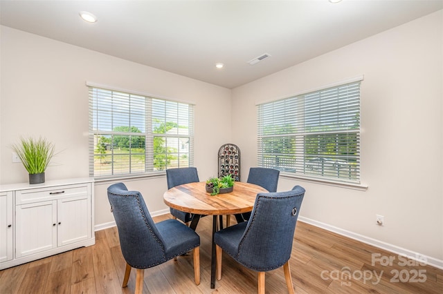 dining area featuring recessed lighting, baseboards, visible vents, and light wood-style floors