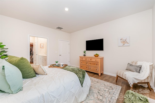 bedroom featuring recessed lighting, baseboards, visible vents, and wood finished floors