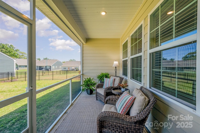 balcony with covered porch and a residential view