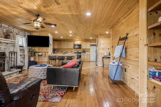 living room featuring recessed lighting, wooden ceiling, light wood-style floors, and a ceiling fan