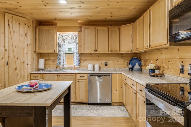kitchen with light countertops, light wood-type flooring, light brown cabinets, and stainless steel appliances