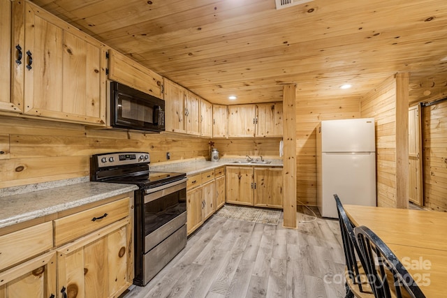 kitchen with freestanding refrigerator, stainless steel electric stove, black microwave, wooden ceiling, and light brown cabinets
