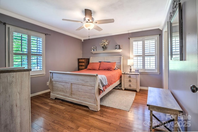 bedroom featuring ornamental molding, multiple windows, and hardwood / wood-style floors