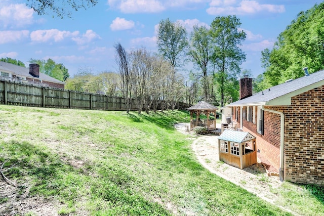 view of yard featuring a gazebo and fence