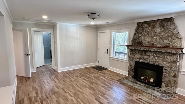 25 Dew Waite Rd, Black Mountain, NC 28711 - unfurnished living room featuring wood finished floors, a large fireplace, and crown molding