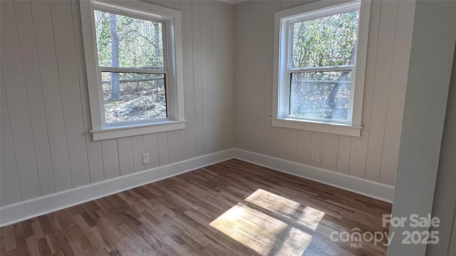 25 Dew Waite Rd, Black Mountain, NC 28711 - spare room featuring plenty of natural light, baseboards, and wood finished floors