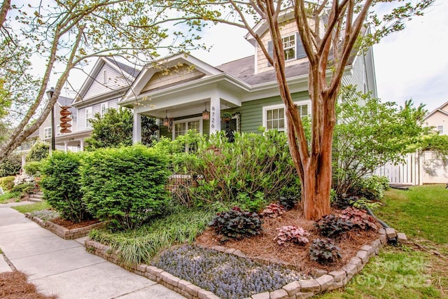 view of front of property featuring fence