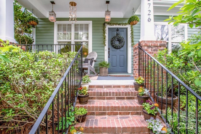entrance to property featuring a porch