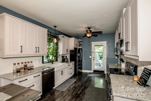 kitchen featuring white cabinets, tasteful backsplash, black appliances, and a ceiling fan