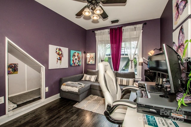 home office with visible vents, baseboards, wood finished floors, and ceiling fan