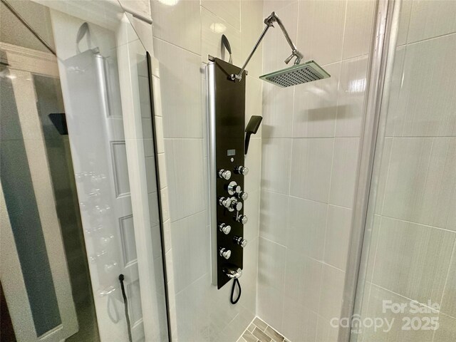 room details featuring a shower stall