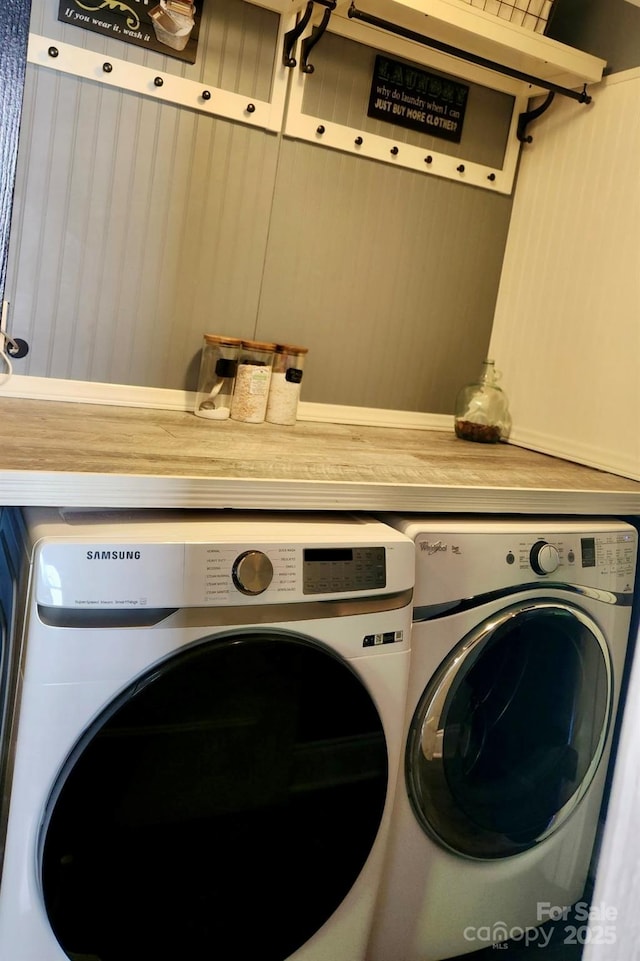 washroom featuring laundry area and washer and clothes dryer