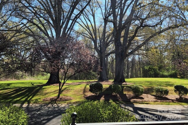 surrounding community with a lawn