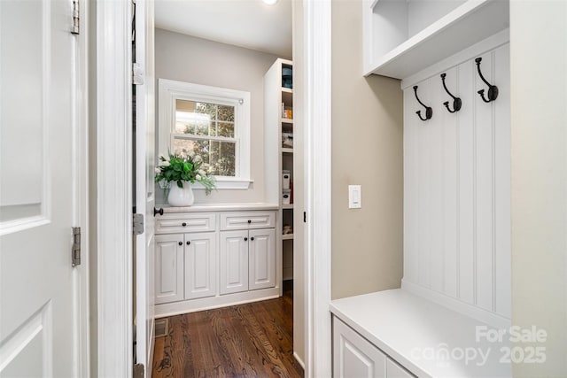 mudroom featuring dark wood finished floors