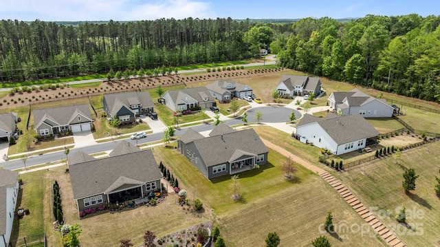 aerial view with a view of trees and a residential view