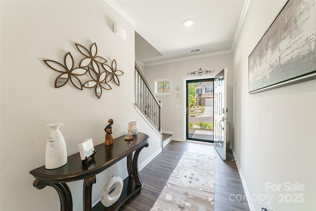 15520 Capps Rd, Charlotte, NC 28278 - foyer entrance featuring crown molding, stairs, dark wood-type flooring, and baseboards