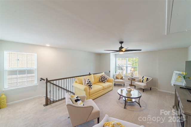 15520 Capps Rd, Charlotte, NC 28278 - living area with attic access, light colored carpet, a ceiling fan, and baseboards