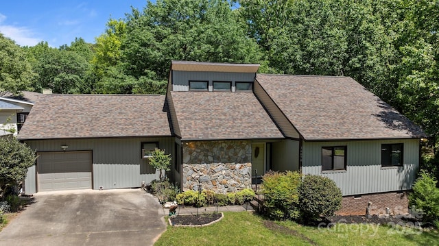 16070 Palawan Ct, Tega Cay, SC 29708 - mid-century home featuring a garage, a shingled roof, and concrete driveway