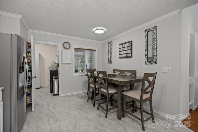 16070 Palawan Ct, Tega Cay, SC 29708 - dining space with a textured ceiling, baseboards, and ornamental molding