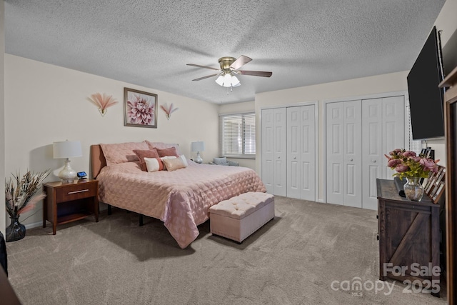 16070 Palawan Ct, Tega Cay, SC 29708 - carpeted bedroom with two closets, ceiling fan, and a textured ceiling